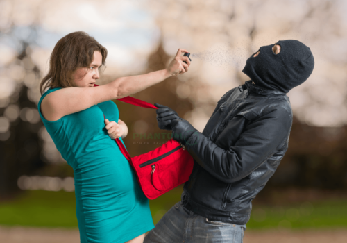woman protects herself with a self-defense product